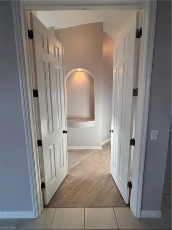 a view of an empty room with a window