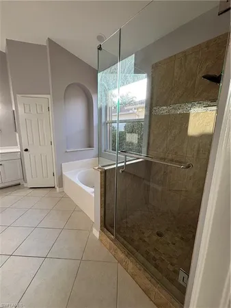 a bathroom with a sink vanity and mirror
