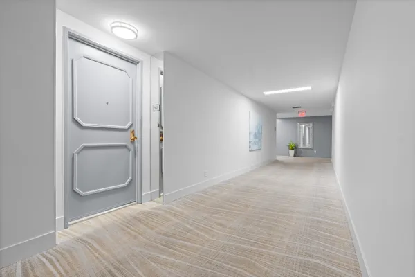a view of an empty room with a bathroom
