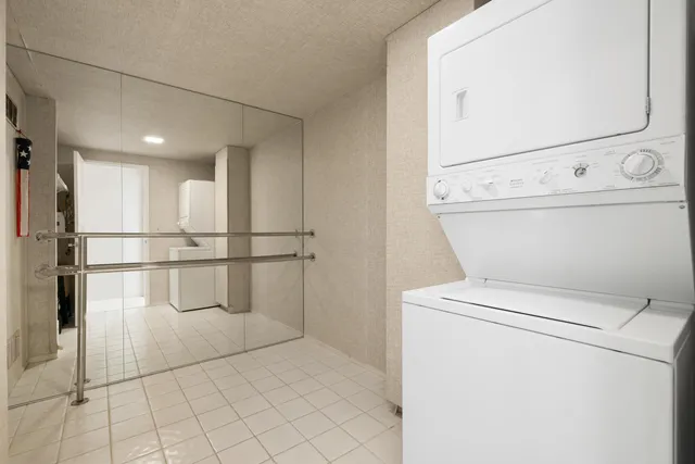 a view of storage and utility room with washer and dryer