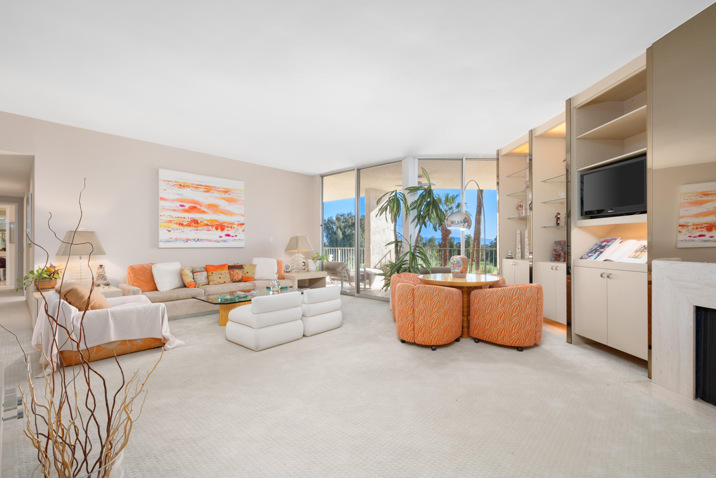 900 Island Drive, Unit 507 Rancho Mirage, CA 92270 - Photo 21 of 37 a living room with furniture and a flat screen tv