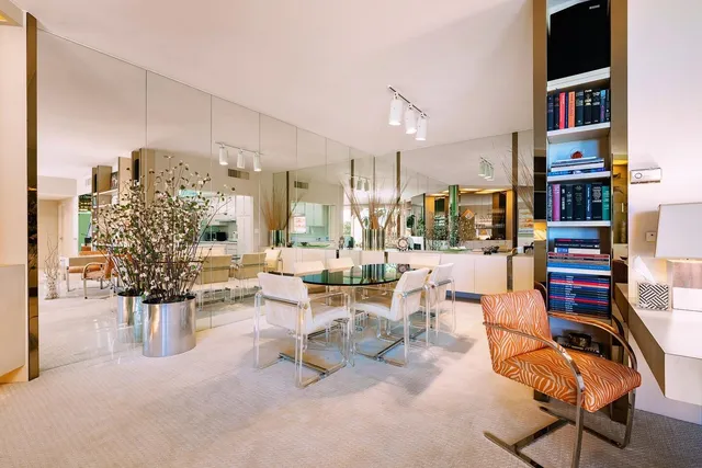 a room with lots of furniture and a view of living room