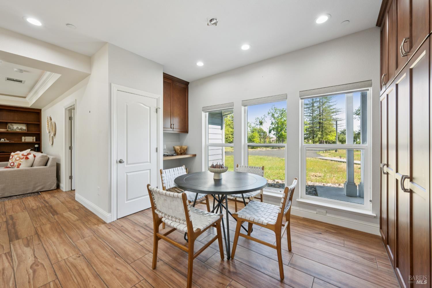 4665 Upper Ridge Road Santa Rosa, CA 95404 - Photo 12 of 71 a dining room with furniture window wooden floor
