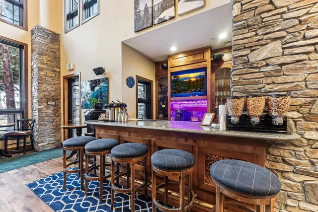 a table and chairs in front of a building