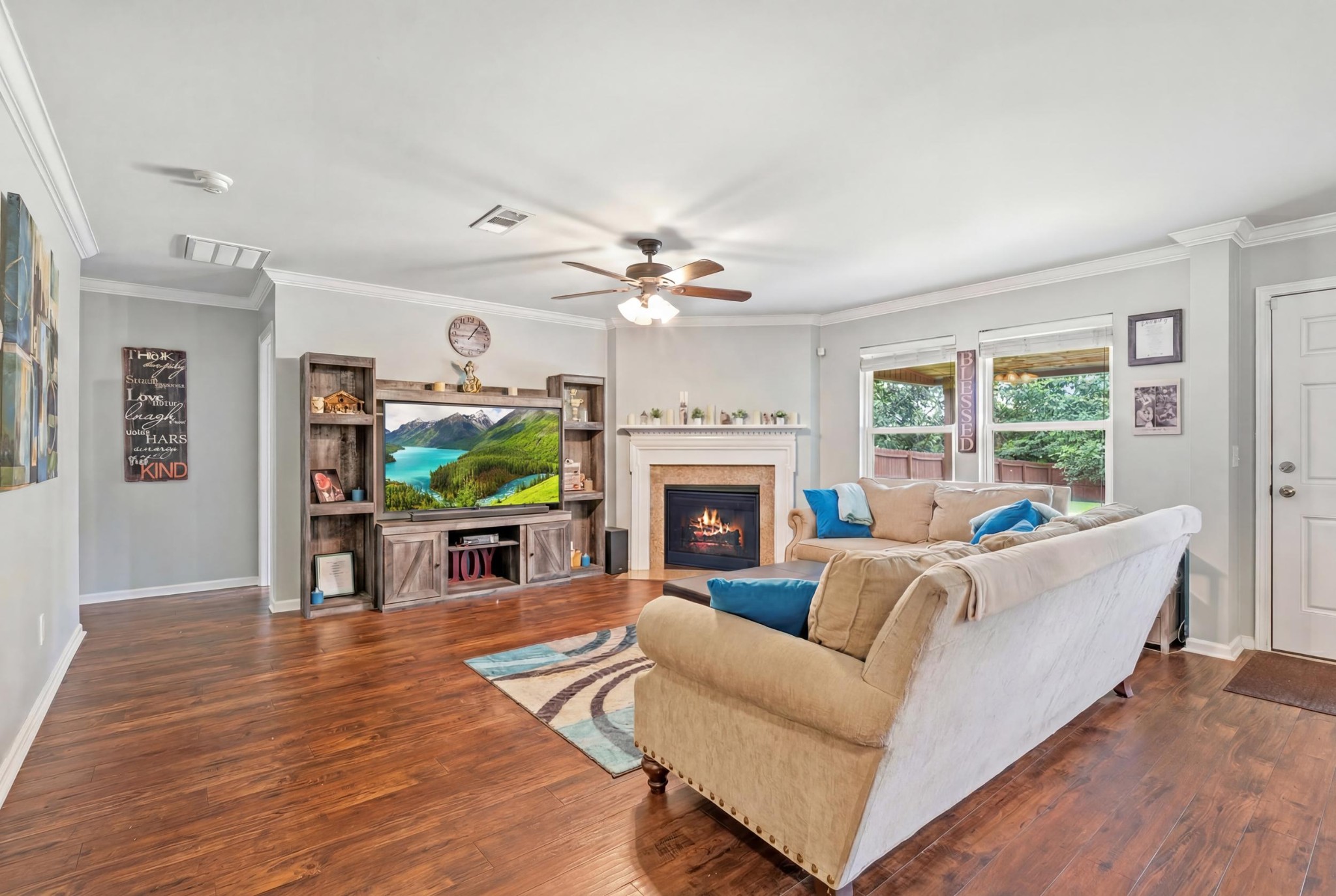 1011 Benwick Road Hendersonville, TN 37075 - Photo 21 of 60 a living room with furniture a fireplace and a flat screen tv