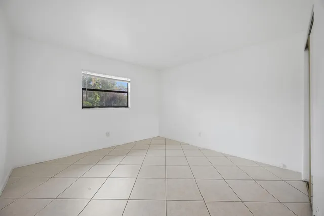 an empty room with white door