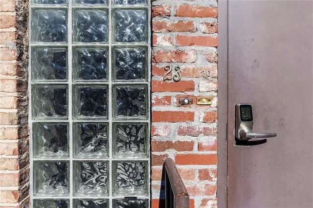 a view of a house with a small deck