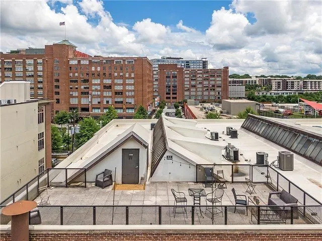 a terrace of a building with table and chairs