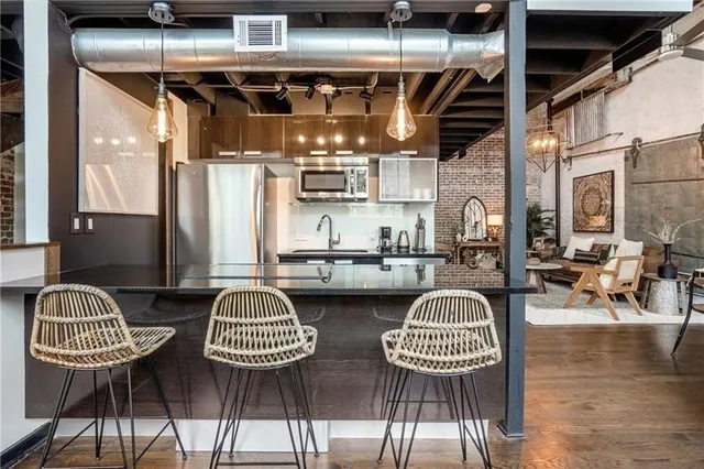 a outdoor living space with furniture and a chandelier