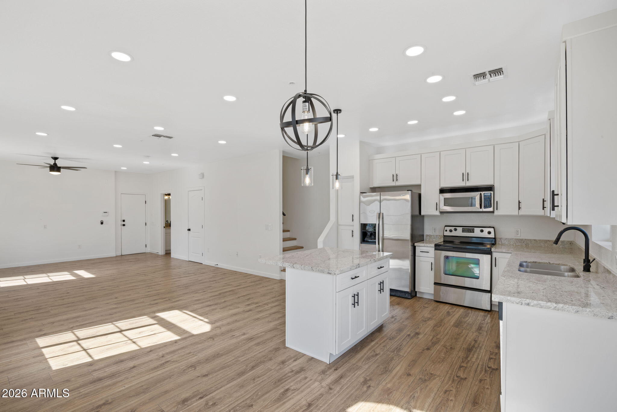 280 South Evergreen Road, Unit 1368 Tempe, AZ 85288 - Photo 10 of 42 a kitchen with stainless steel appliances granite countertop a sink refrigerator and cabinets