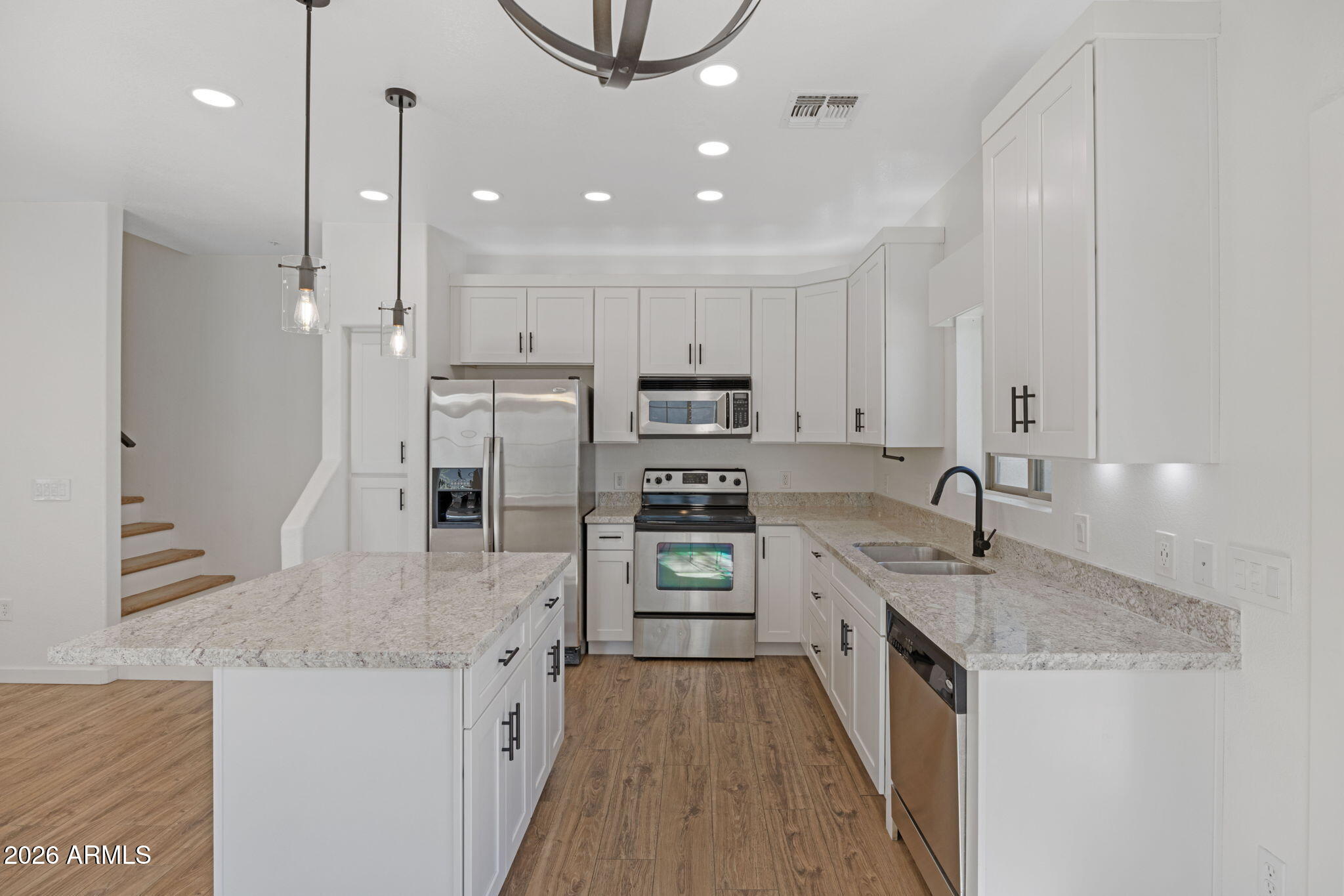 280 South Evergreen Road, Unit 1368 Tempe, AZ 85288 - Photo 13 of 42 a kitchen with stainless steel appliances granite countertop a sink stove and refrigerator