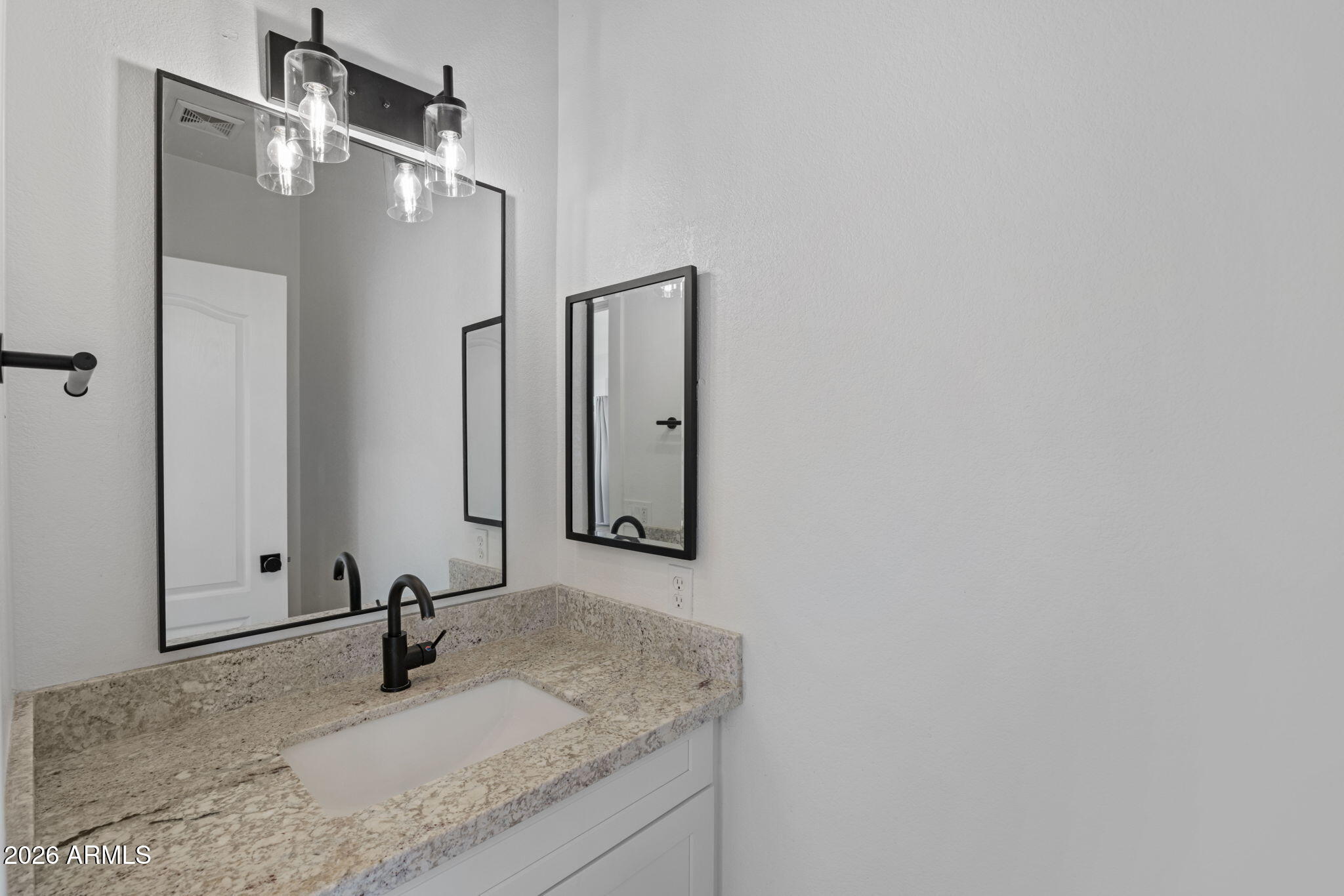 280 South Evergreen Road, Unit 1368 Tempe, AZ 85288 - Photo 17 of 42 a bathroom with a granite countertop sink and a mirror