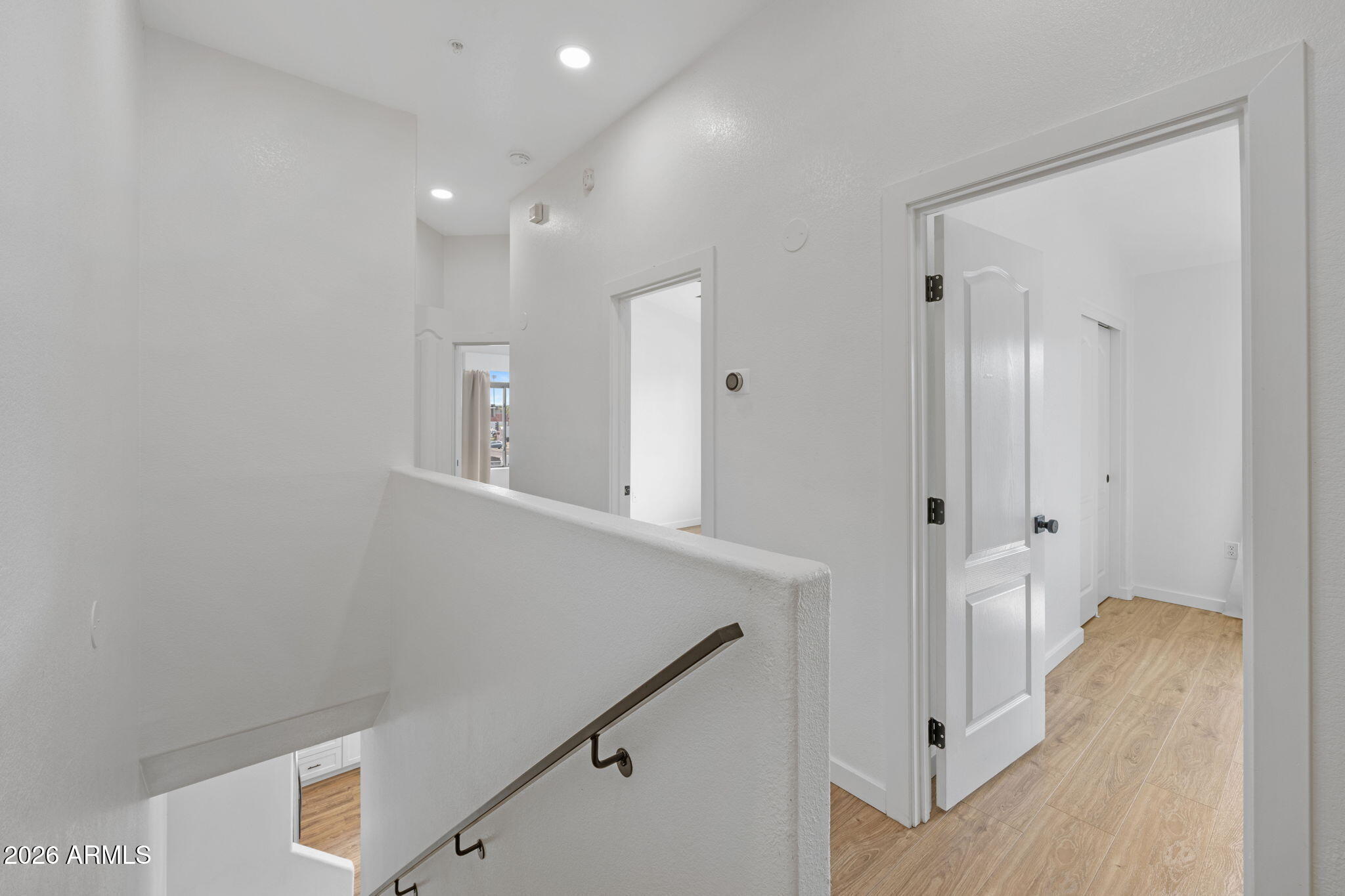 280 South Evergreen Road, Unit 1368 Tempe, AZ 85288 - Photo 18 of 42 a view of a hallway with wooden floor
