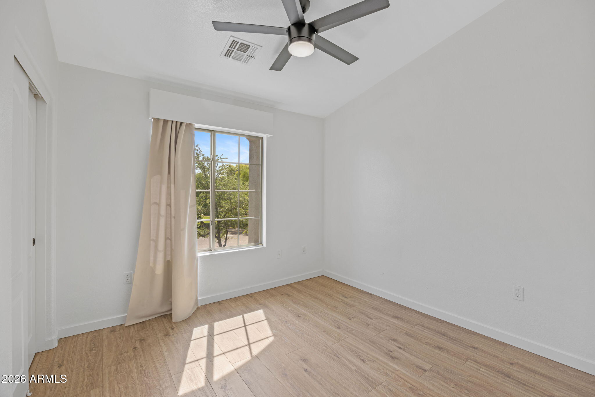 280 South Evergreen Road, Unit 1368 Tempe, AZ 85288 - Photo 20 of 42 wooden floor in an empty room with a window