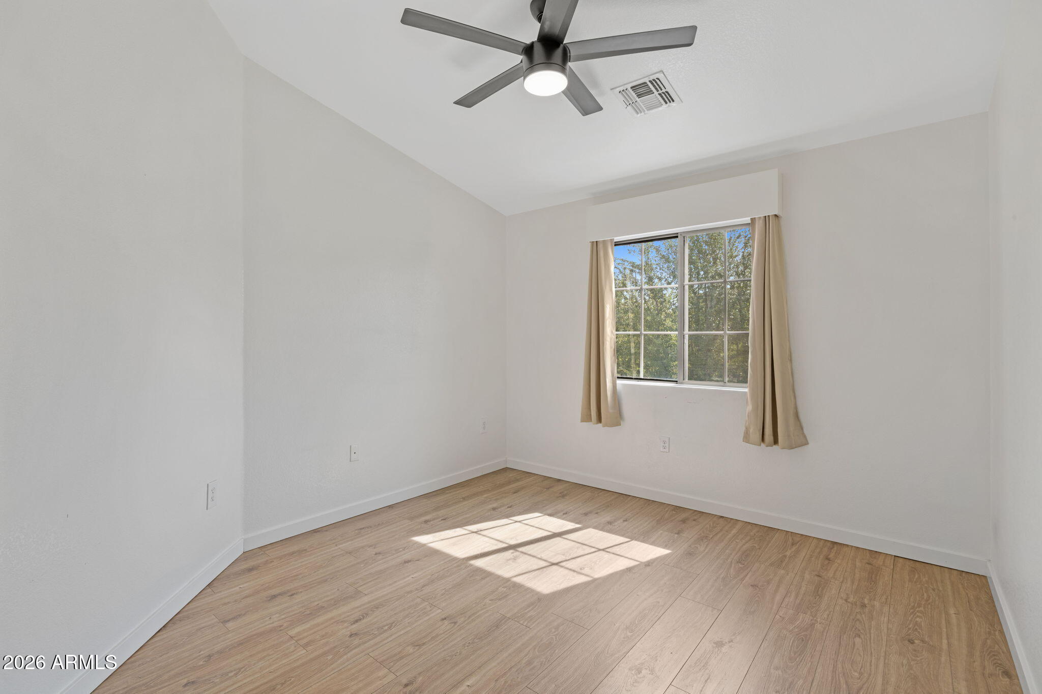 280 South Evergreen Road, Unit 1368 Tempe, AZ 85288 - Photo 21 of 42 wooden floor in an empty room with a window