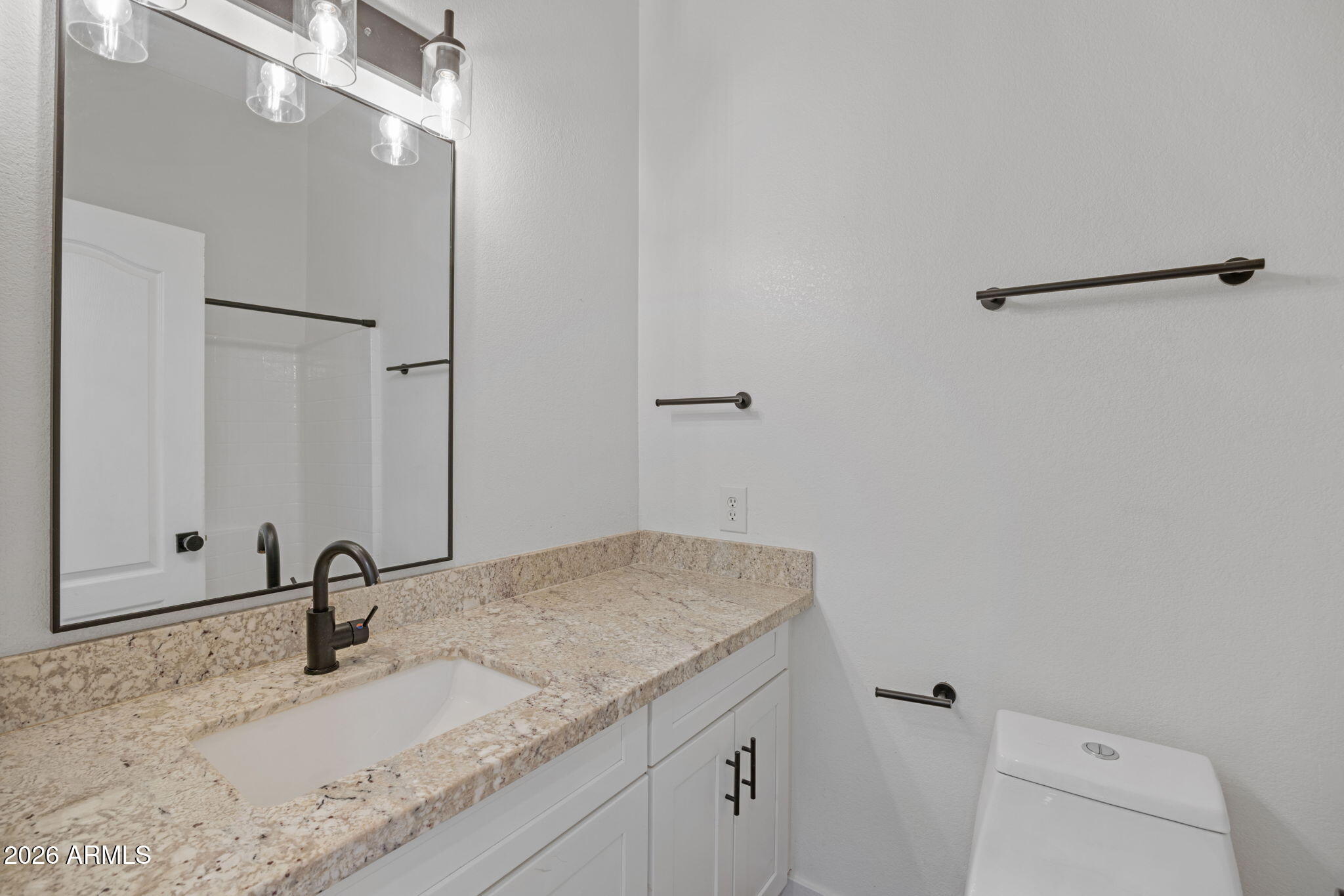 280 South Evergreen Road, Unit 1368 Tempe, AZ 85288 - Photo 22 of 42 a bathroom with a sink and a mirror