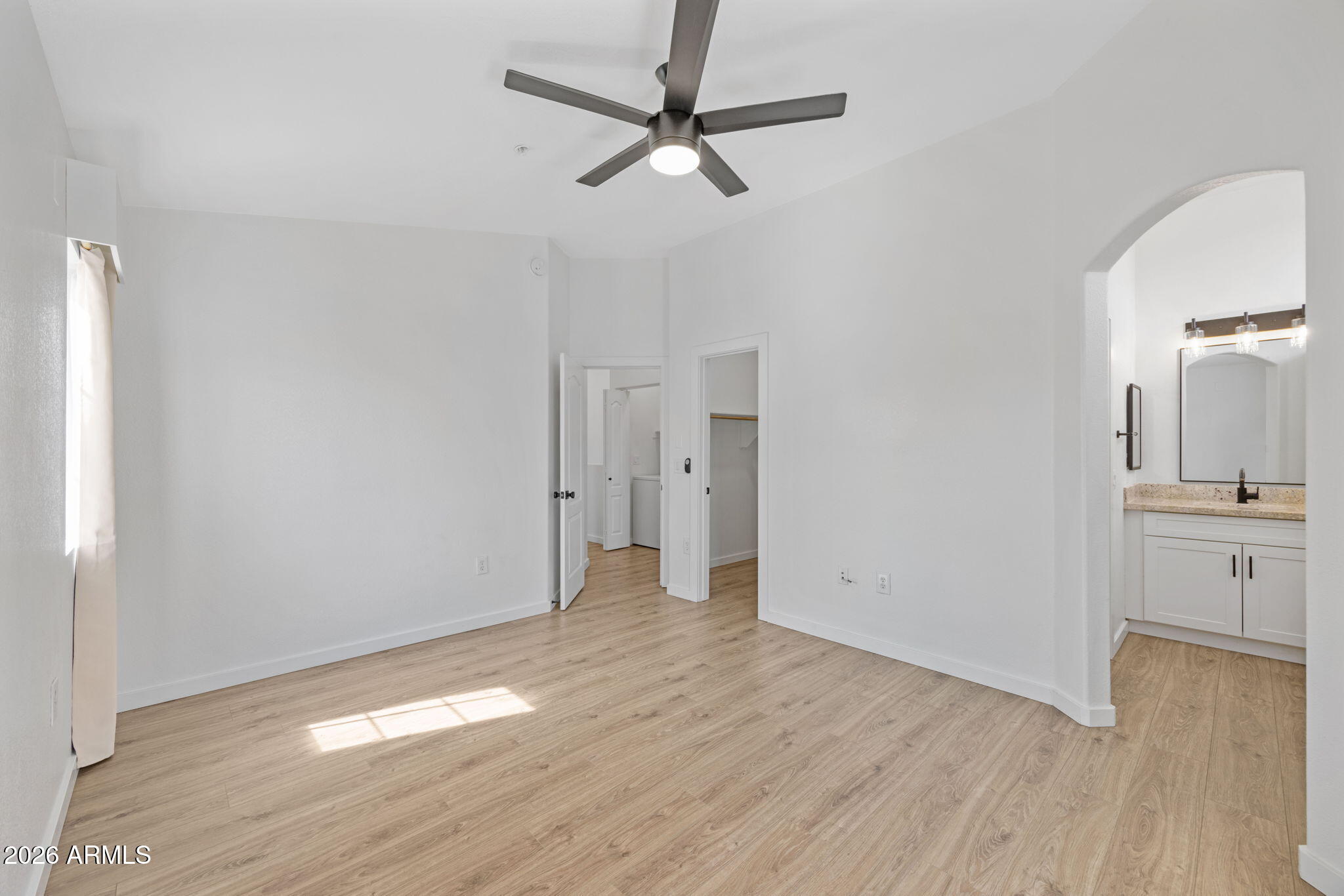 280 South Evergreen Road, Unit 1368 Tempe, AZ 85288 - Photo 26 of 42 a view of a kitchen with wooden floor and a ceiling fan