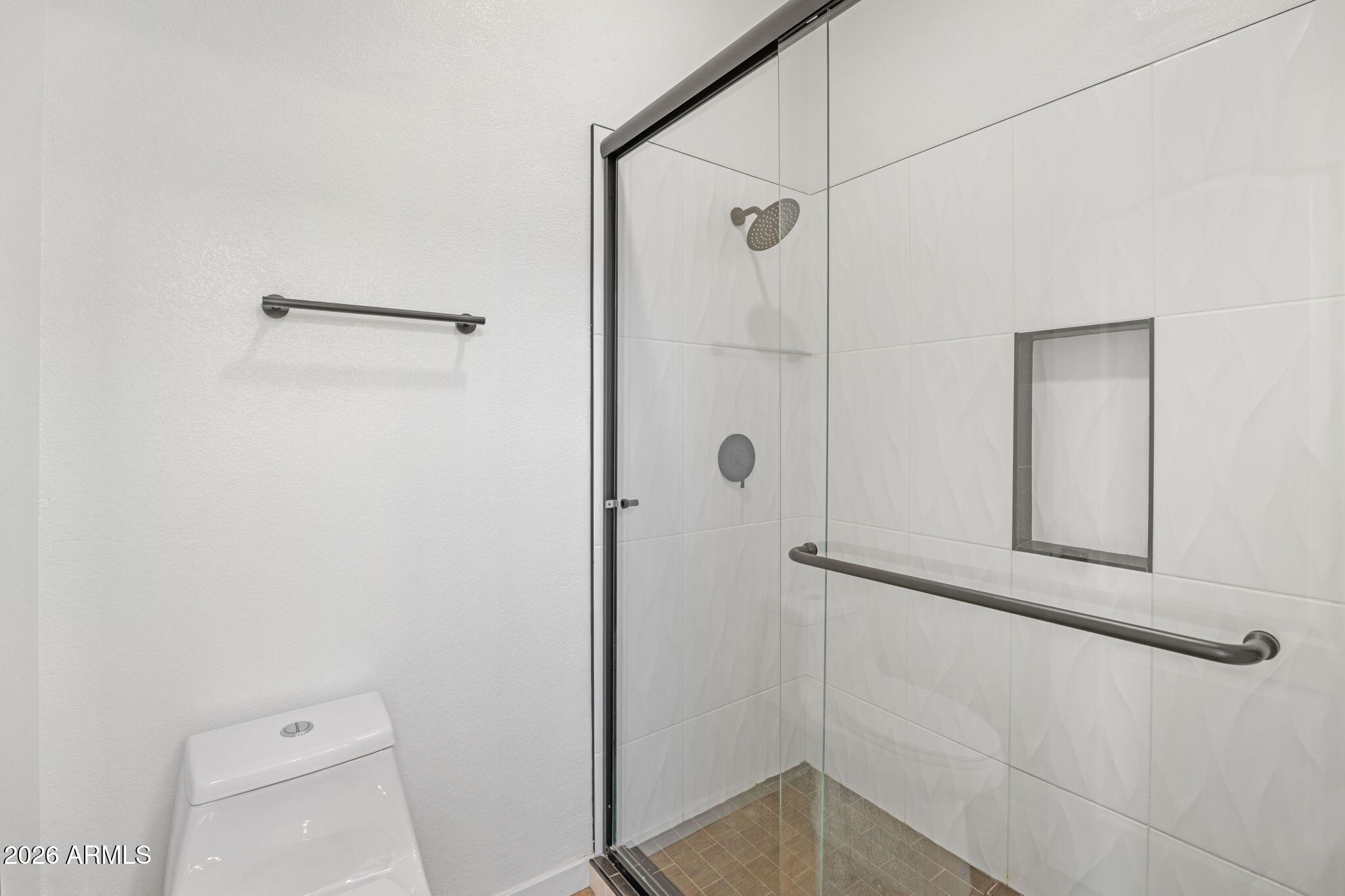 280 South Evergreen Road, Unit 1368 Tempe, AZ 85288 - Photo 28 of 42 a bathroom with a shower and toilet