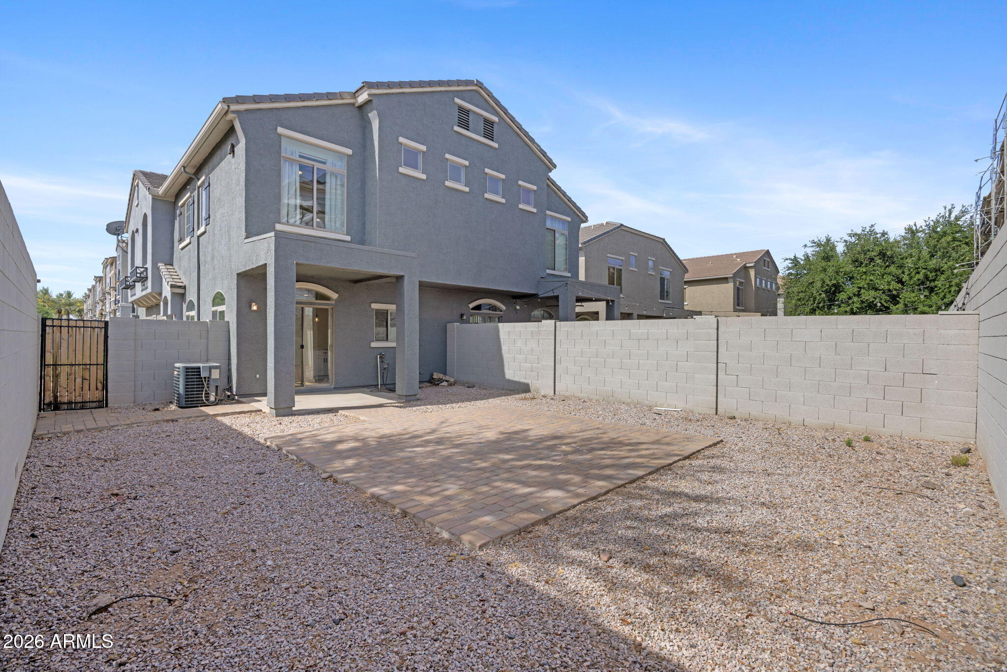 280 South Evergreen Road, Unit 1368 Tempe, AZ 85288 - Photo 31 of 42 a front view of a house with a yard and garage