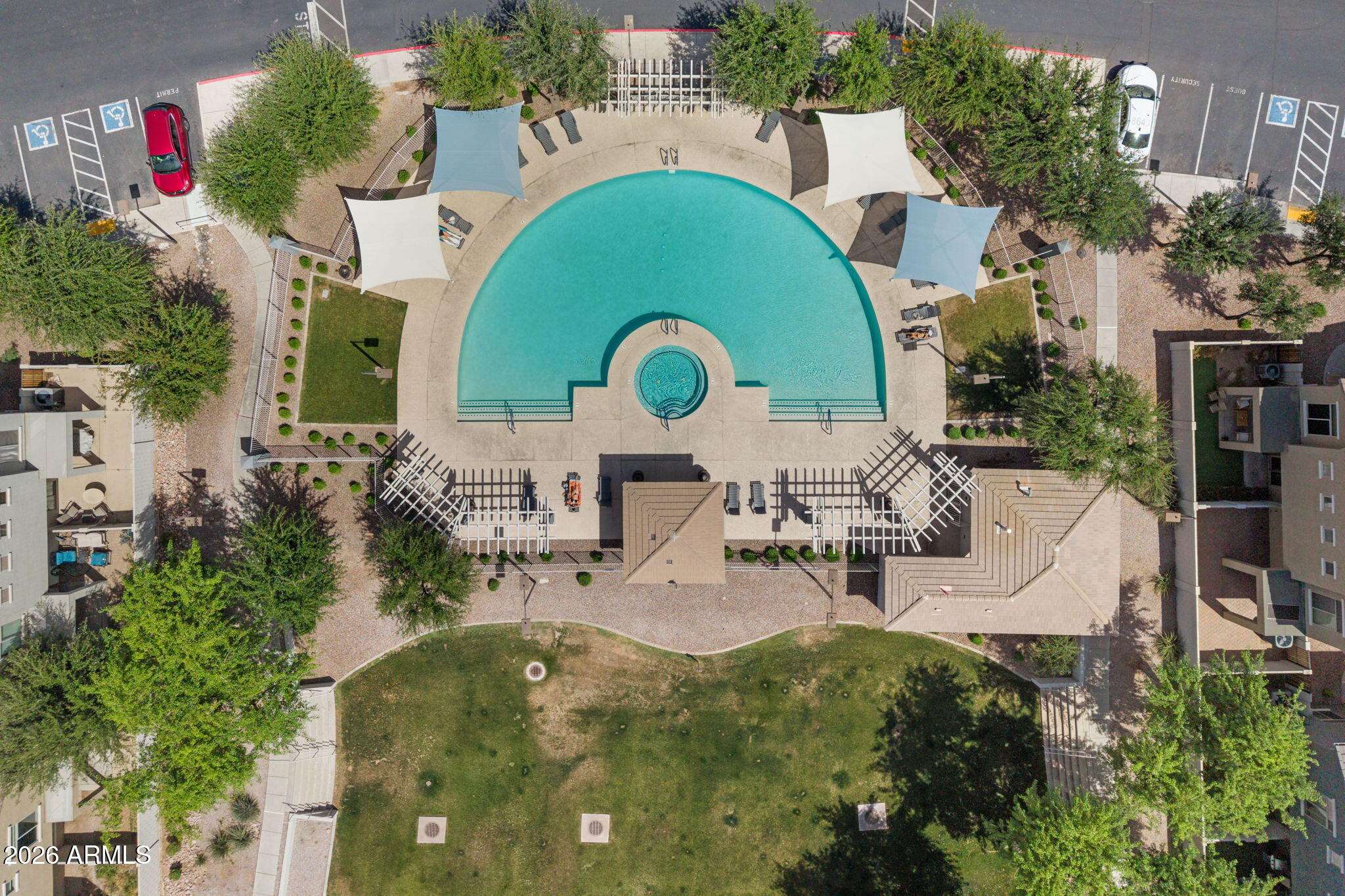 280 South Evergreen Road, Unit 1368 Tempe, AZ 85288 - Photo 36 of 42 an aerial view of a swimming pool with outdoor seating and trees