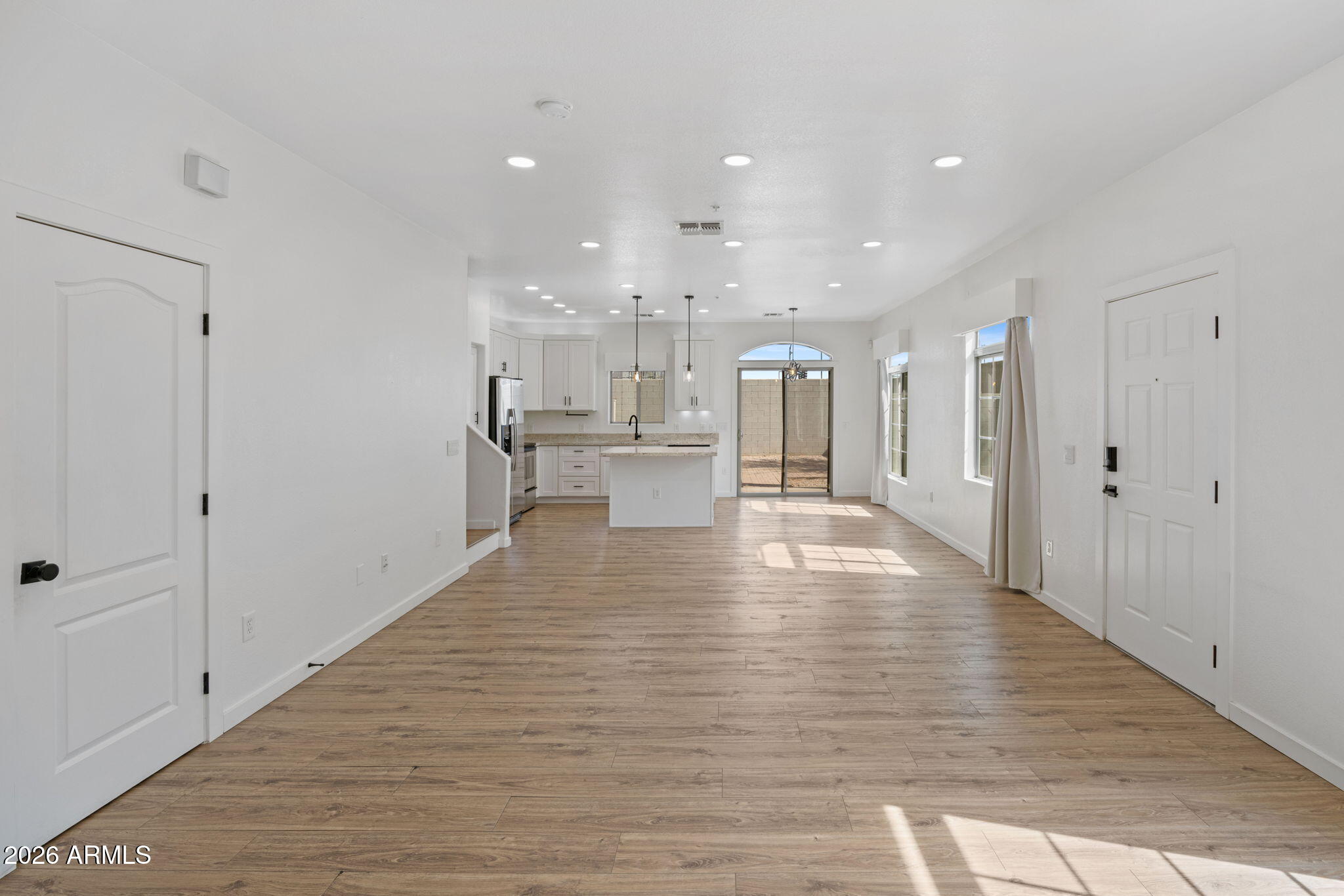 280 South Evergreen Road, Unit 1368 Tempe, AZ 85288 - Photo 5 of 42 a view of large kitchen with a refrigerator and a wooden floor