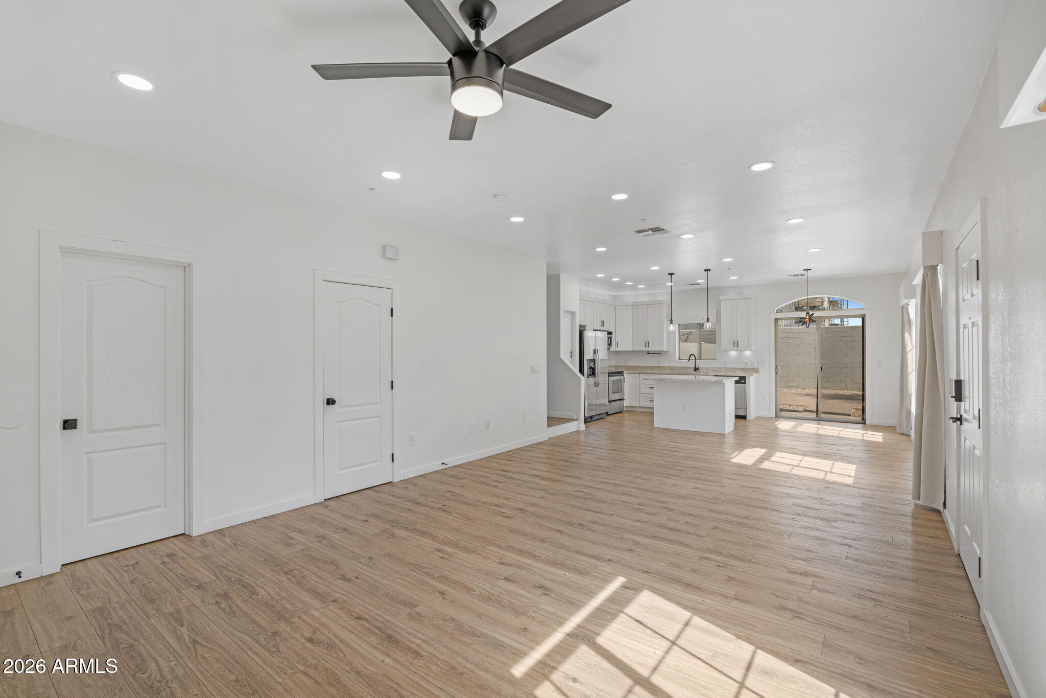 280 South Evergreen Road, Unit 1368 Tempe, AZ 85288 - Photo 8 of 42 a view of a kitchen with kitchen island a sink stainless steel appliances and cabinets