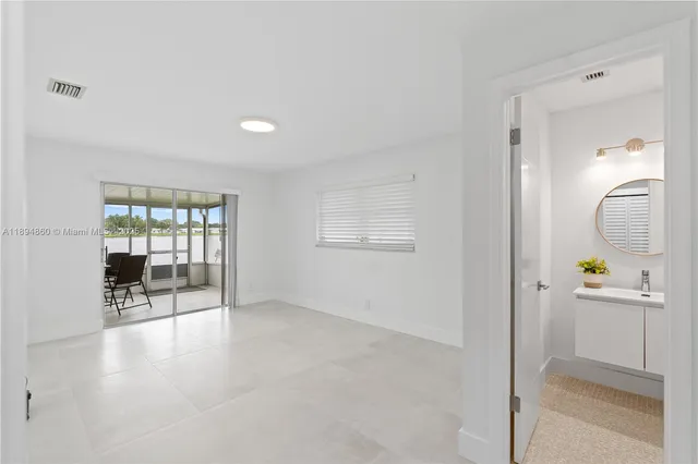 a view of a kitchen with furniture and a window
