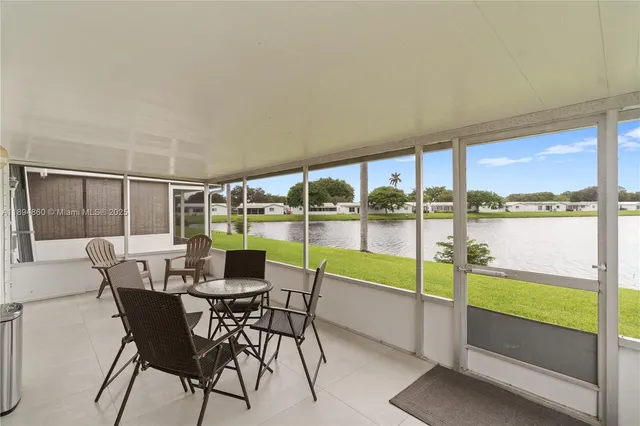 an aerial view of a swimming pool playground and mountain view in back