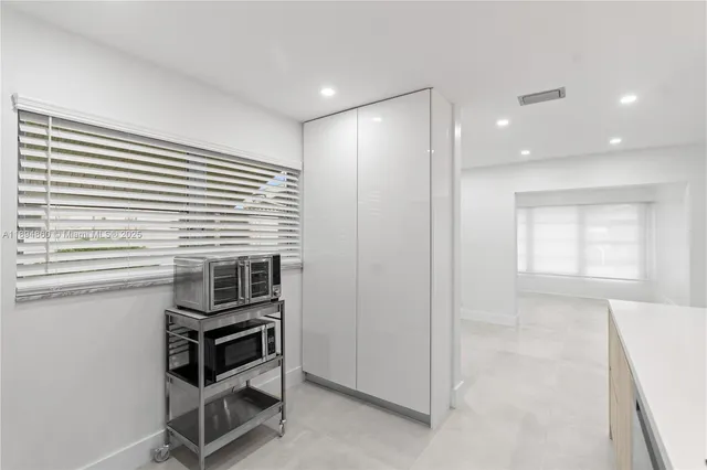 a view of kitchen and wooden floor