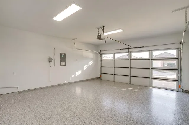 a view of a backyard with wooden fence