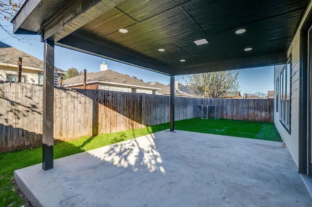 a view of house with backyard