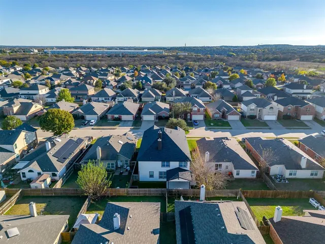 an aerial view of house with yard