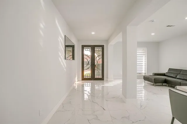 a view of a livingroom with furniture and windows