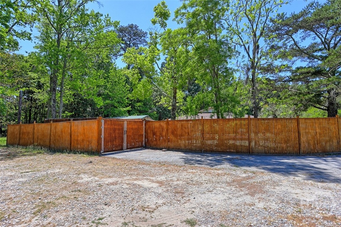 113 Country Lane Pooler, GA 31322 - Photo 47 of 51 Two gates to side yard. One is remote control