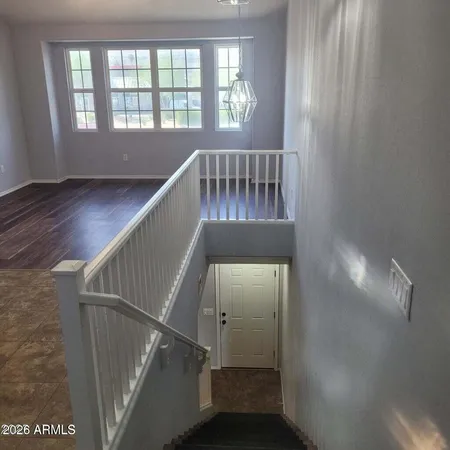 a view of entryway with stairs and wooden floor