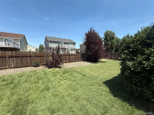 a view of backyard with green space