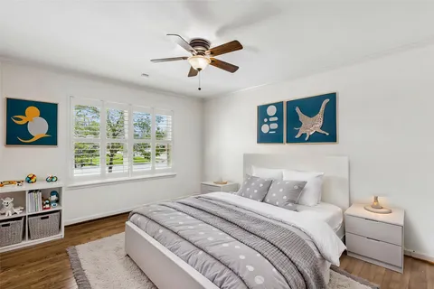 a bedroom with a large bed and a window