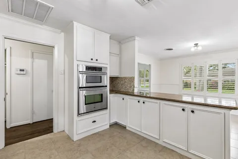 a kitchen with stainless steel appliances a stove and a refrigerator
