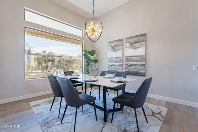 a living room with furniture and a view of kitchen