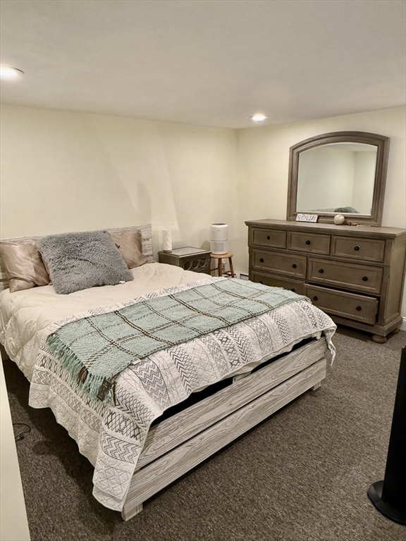 40 Chappie Street, Unit 1 Boston, MA 02129 - Photo 5 of 10 a bedroom with a bed and a flat screen tv