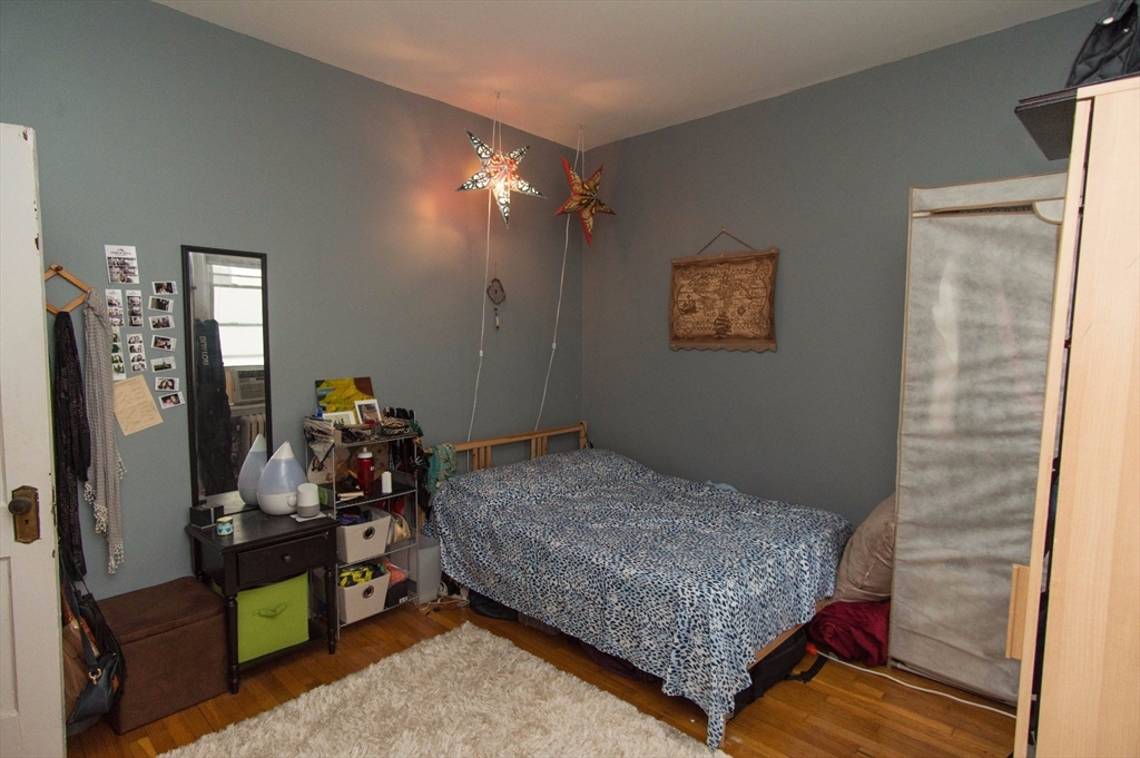 233 Kelton Street, Unit 1 Boston, MA 02134 - Photo 6 of 11 a bedroom with bed and a window