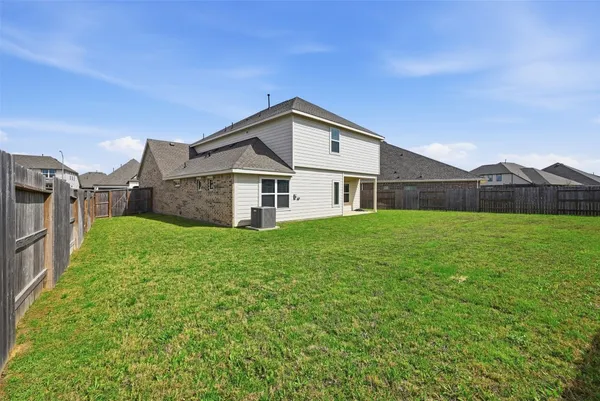a view of a house with a big yard