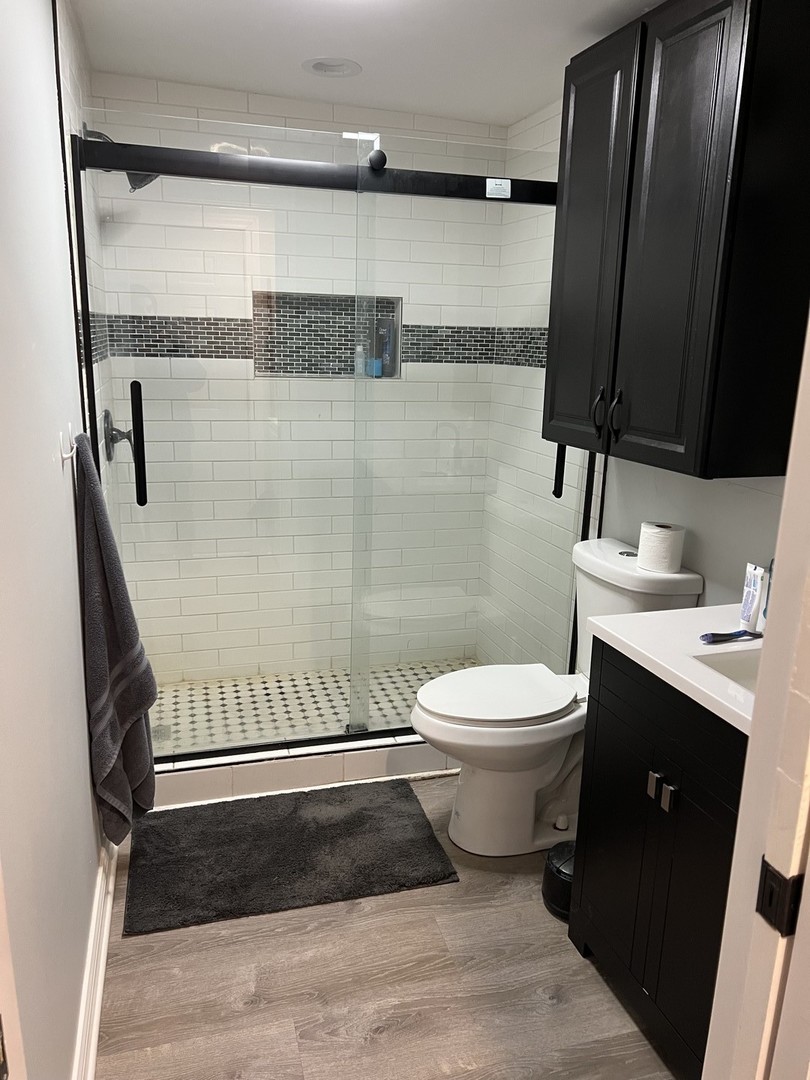 1205 Rattray Drive Algonquin, IL 60102 - Photo 23 of 28 a bathroom with a toilet a sink and shower