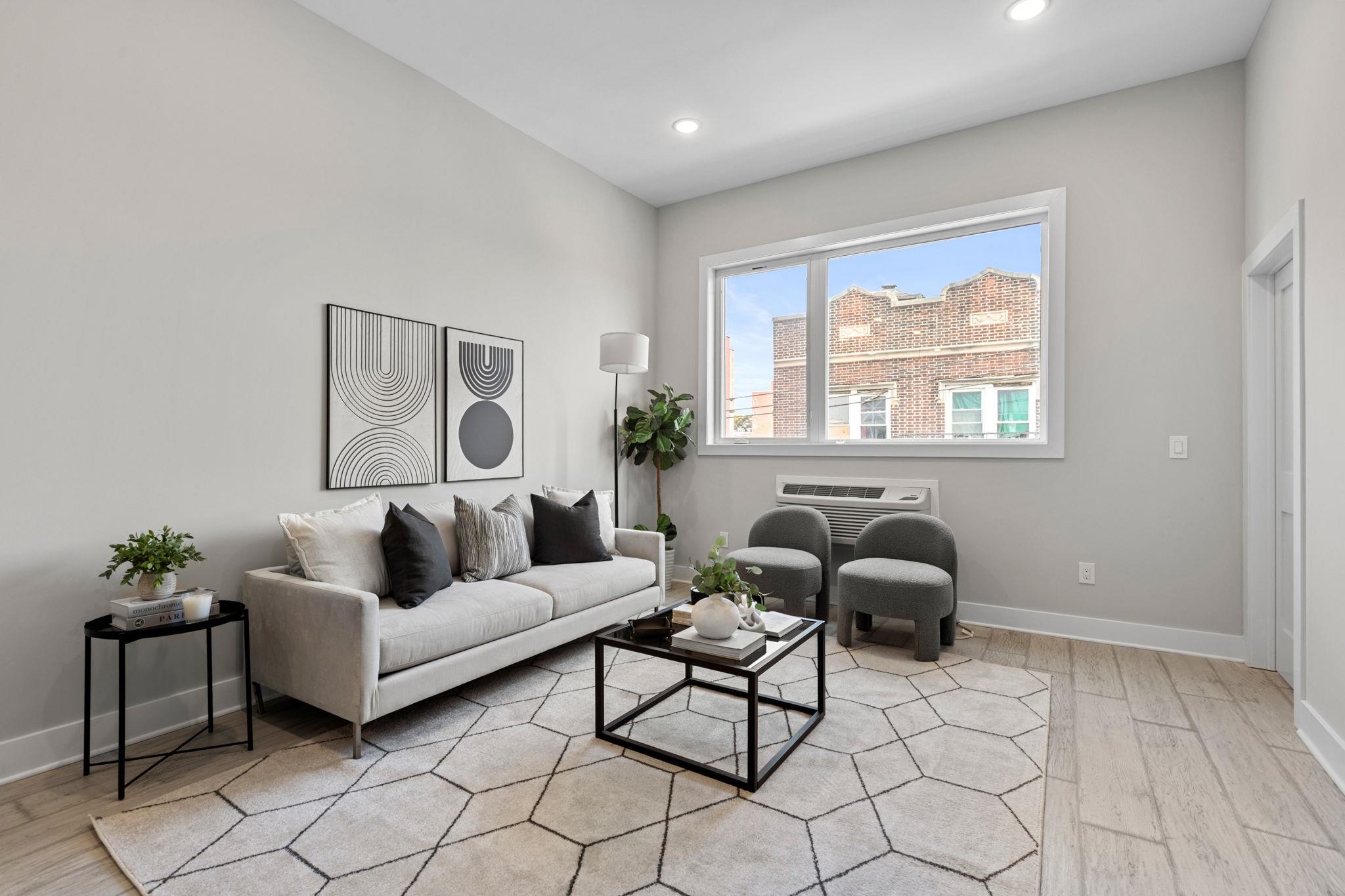 a living room with furniture and a window