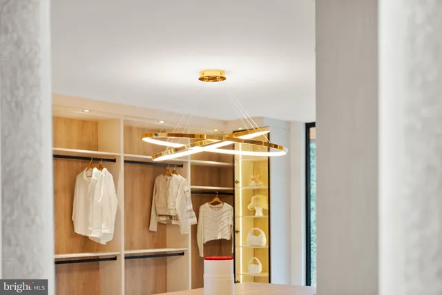 a bedroom with a large bed and a large window