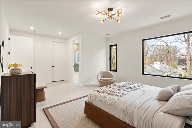 a bedroom with a large bed and a couch