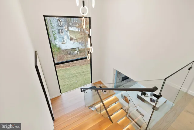 a kitchen with stainless steel appliances granite countertop a sink a stove and a microwave