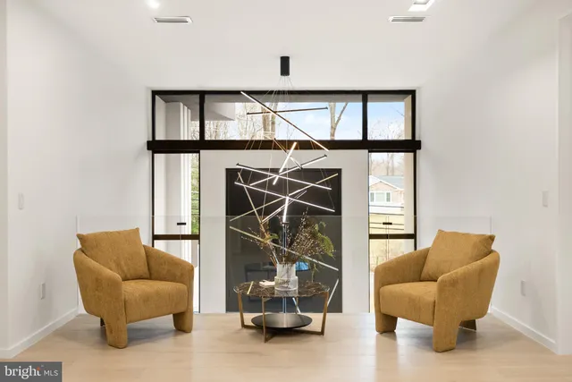 a bathroom with a granite countertop sink and a shower curtain