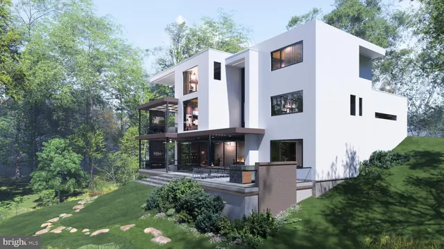 a front view of a house with plants and trees