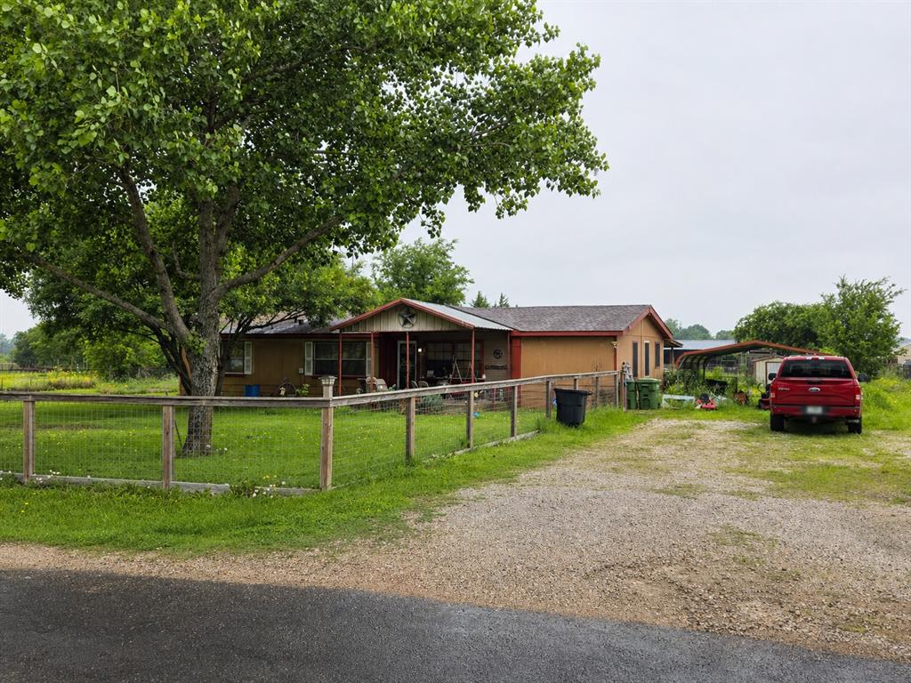 142 Hill Road Ferris, TX 75125 - Photo 1 of 2 Single-story residence featuring a covered front porch, a gravel driveway, and a partially fenced yard